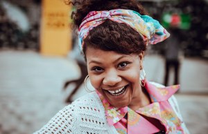 woman in colorful headband and shirt