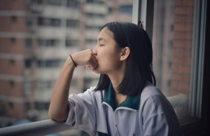 Girl looking out window