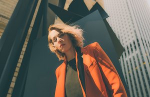 woman in orange blazer