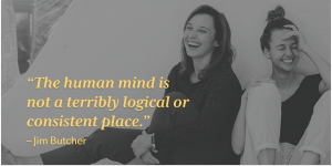 Two women sitting on the floor and laughing behind quote: "The human mind is not a terribly logical or consistent place."