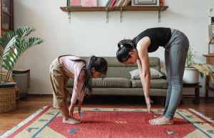 photo-of-woman-and-girl-stretching-their-body