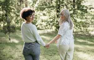 Couple holding hands in forest