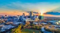 Raleigh skyline with the sun poking through